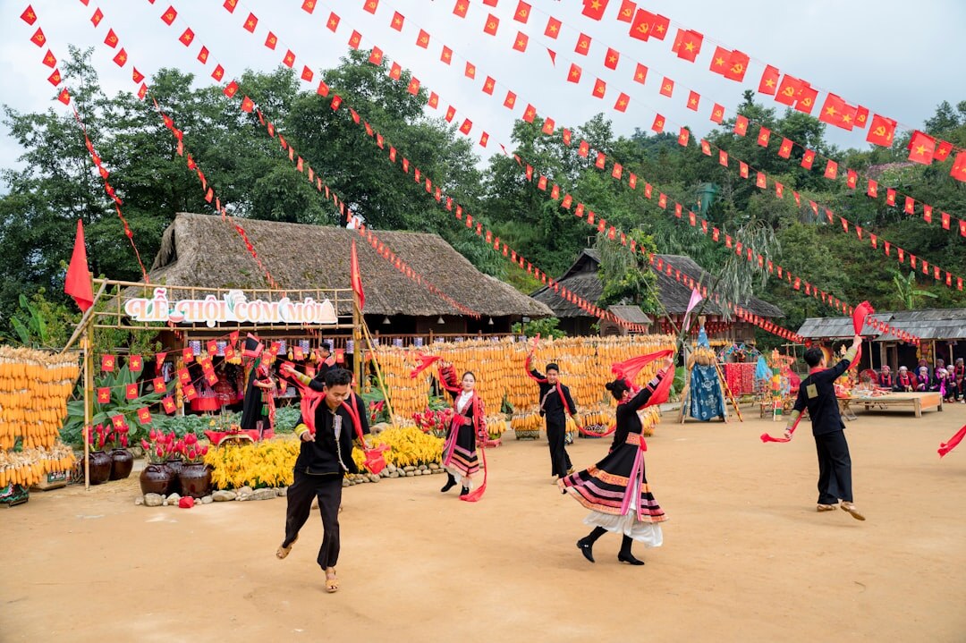 Folk dancers in traditional Slavonian costumes performing at a village festival