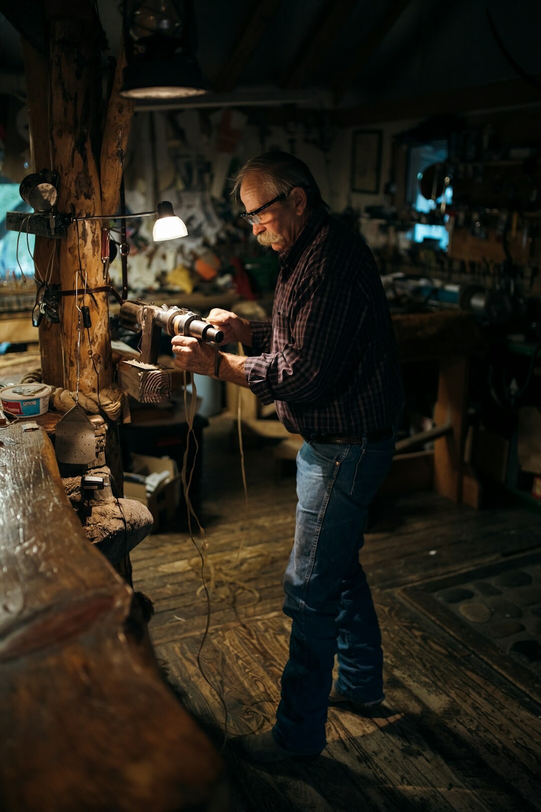 Croatian traditional wooden boat builder working in his workshop